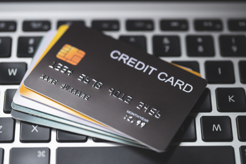 A selection of credit cards on a computer keyboard.