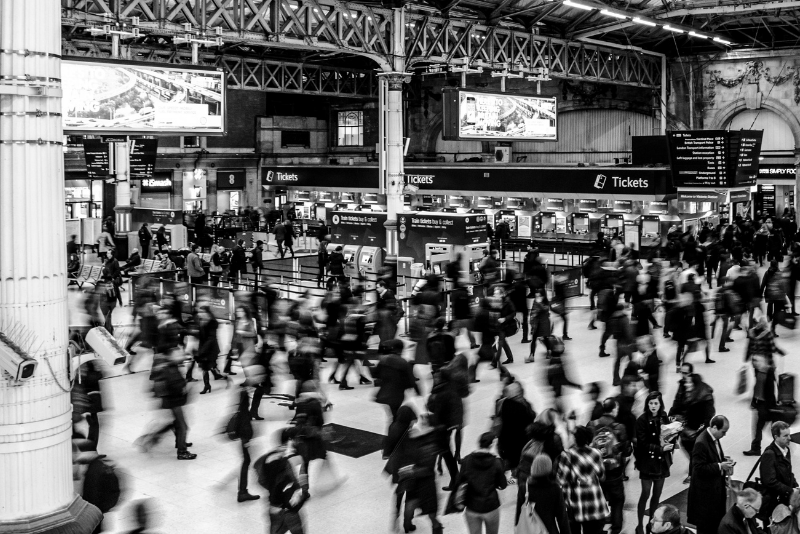 a blurred image of a busy train station.