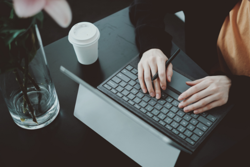 A person working at a laptop.