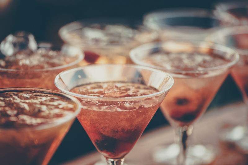 A row of 3 martini style cocktails